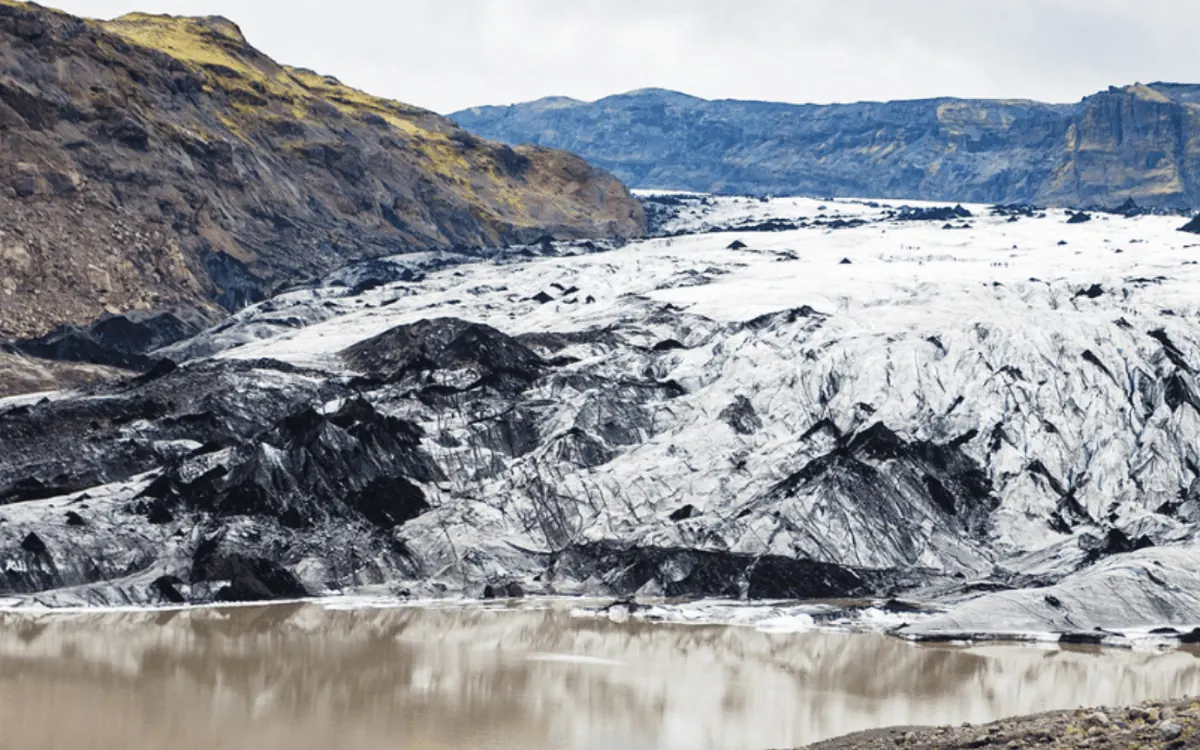 The grey ash-streaked tongue of Solheimajokull glacier in south Iceland