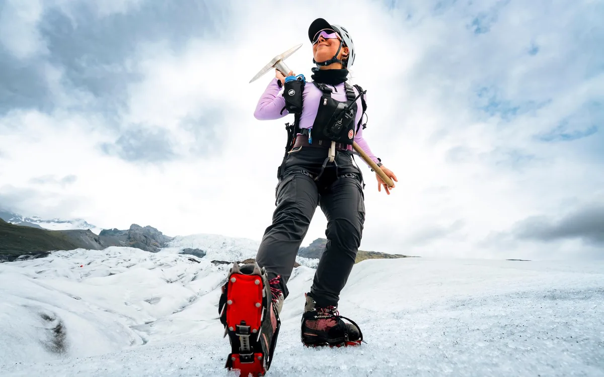 A hiker in crampons on a glacier in south Iceland