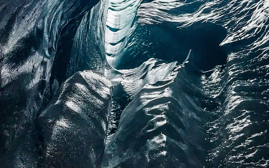 Ice climbing equipment laid out on the surface of a glacier in Iceland