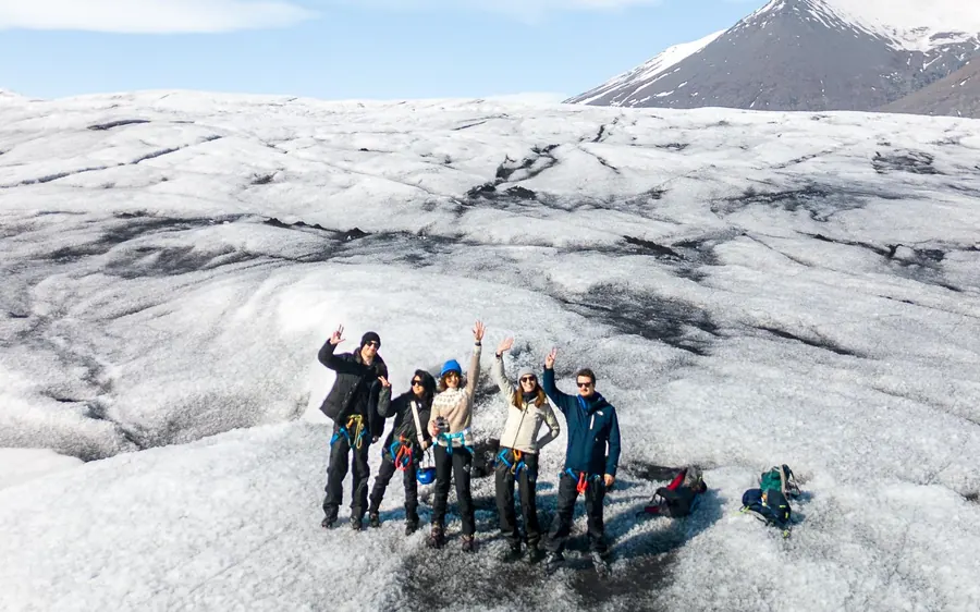 A line of hikers crossing Vatnajokull glacier above Jokulsarlon, Iceland